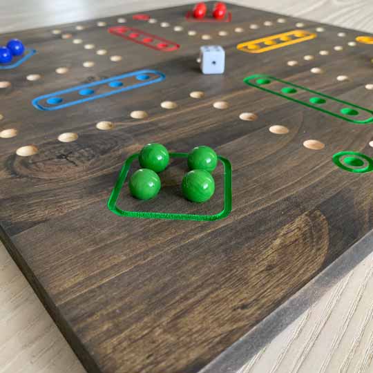 4 player wooden aggravation board game with marbles and dice