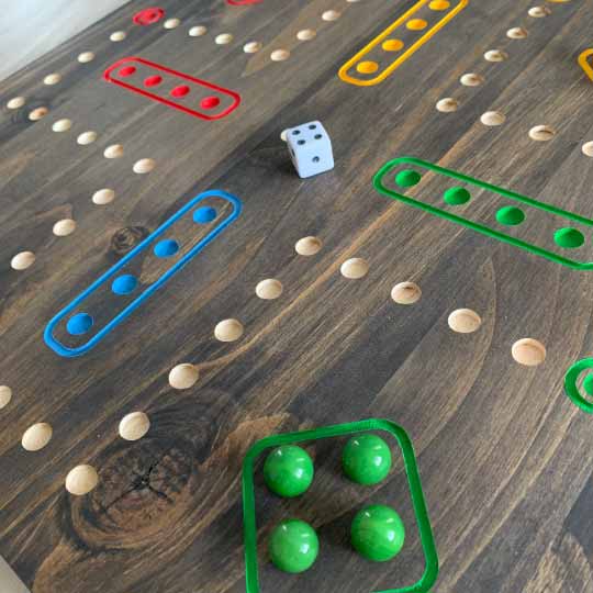 Double-Sided Wooden Aggravation board game with Marbles and Dice.  Both 6 and 4 player versions on one board