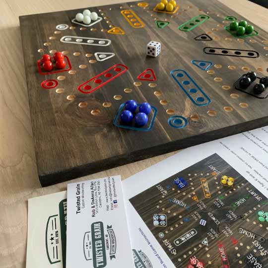 Double-Sided Wooden Aggravation board game with Marbles and Dice.  Both 6 and 4 player versions on one board